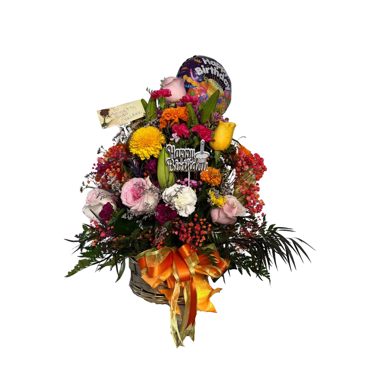 Birthday basket arrangement with pink roses, yellow rose, mixed flowers, birthday pick, and balloon in Houston