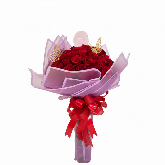 Red rose birthday bouquet with luxury wrap and festive accents for Houston flower delivery