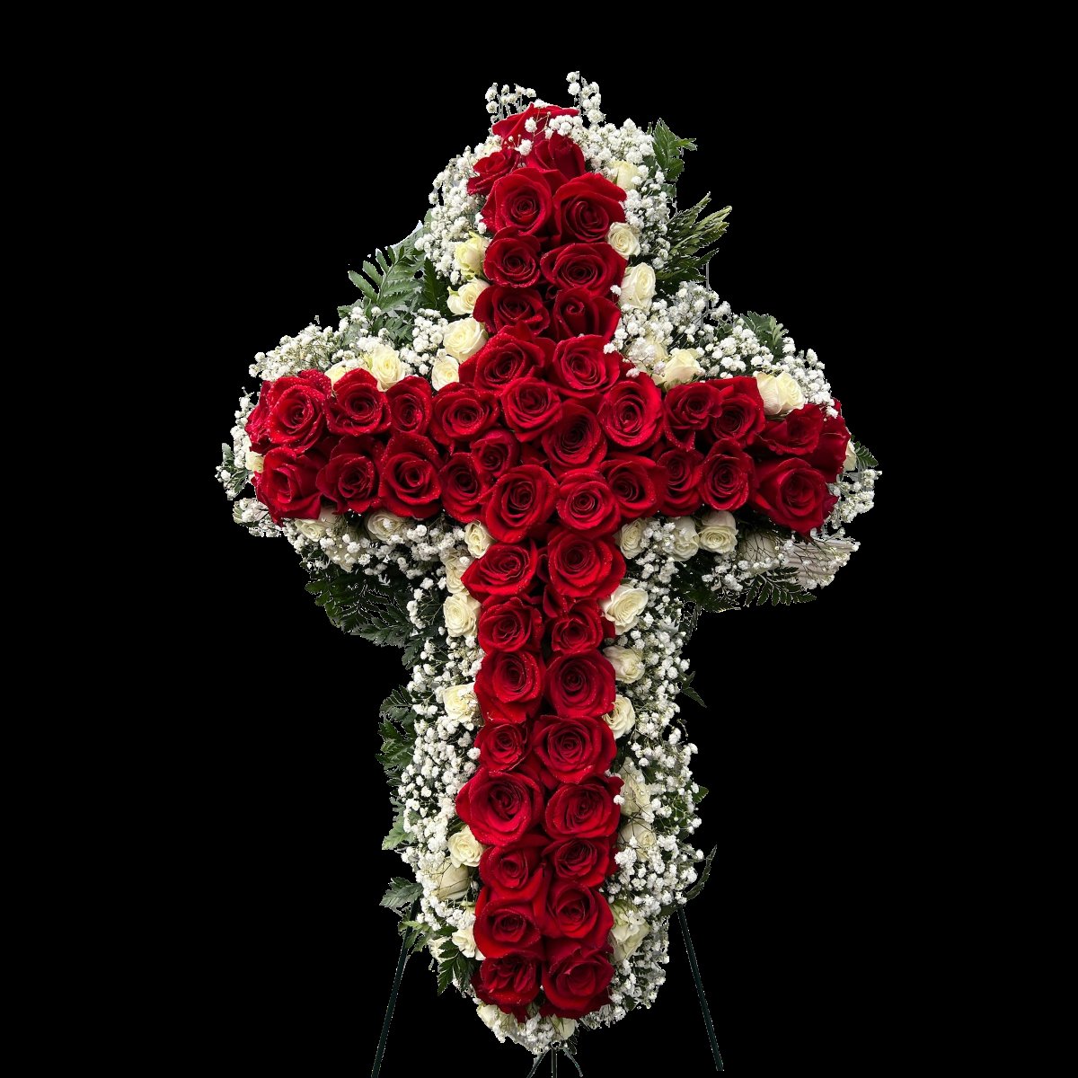 Red rose funeral cross arrangement with white accent roses and greenery on easel stand in Houston