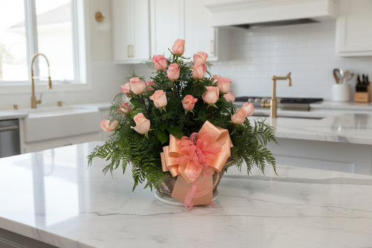 Elegant blush pink rose flower basket with lush greenery for Houston flower delivery
