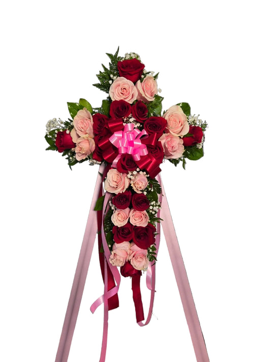 Elegant pink and red rose funeral cross spray on standing easel for sympathy and memorial service with Houston Tx Delivery