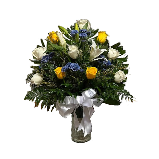 Blue yellow and white vase arrangement with roses lilies fresh greenery and ribbon by Houston florist