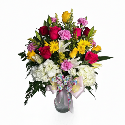 Colorful birthday hydrangea vase arrangement with roses lilies carnations and fresh greenery by Houston florist