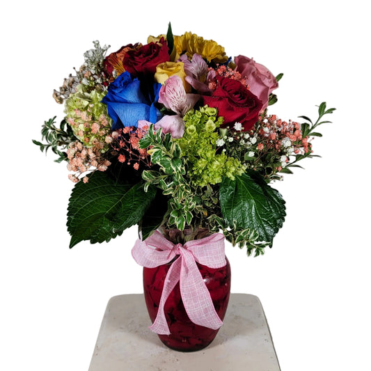 Colorful mixed flower vase arrangement with roses hydrangea and seasonal accents for Houston flower delivery
