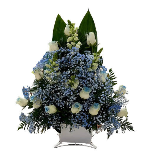 Funeral basket with white roses blue baby breath snapdragons and greenery for Houston flower delivery