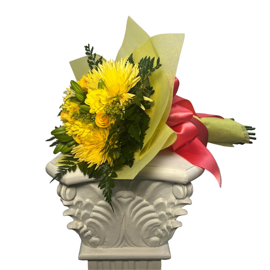 Medium yellow flower bouquet wrapped in elegant paper for same-day flower delivery in Houston