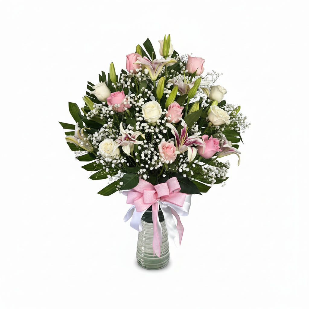 Pink and white rose lily birthday arrangement with baby breath ribbon and balloon by Houston florist