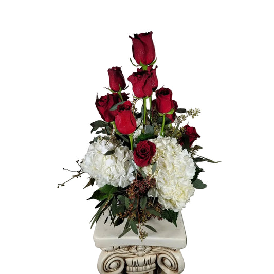 Red rose and white hydrangea arrangement with eucalyptus and fresh greenery by Houston florist
