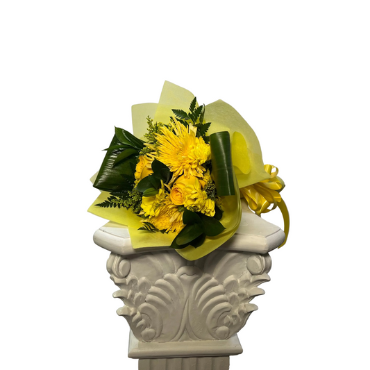 Small yellow wrapped bouquet with roses and mums for same-day flower delivery in Houston