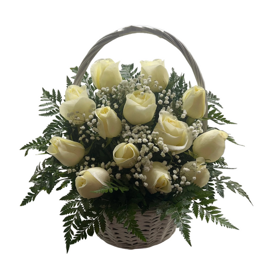 White rose basket arrangement with fresh greenery and ribbon by Houston florist