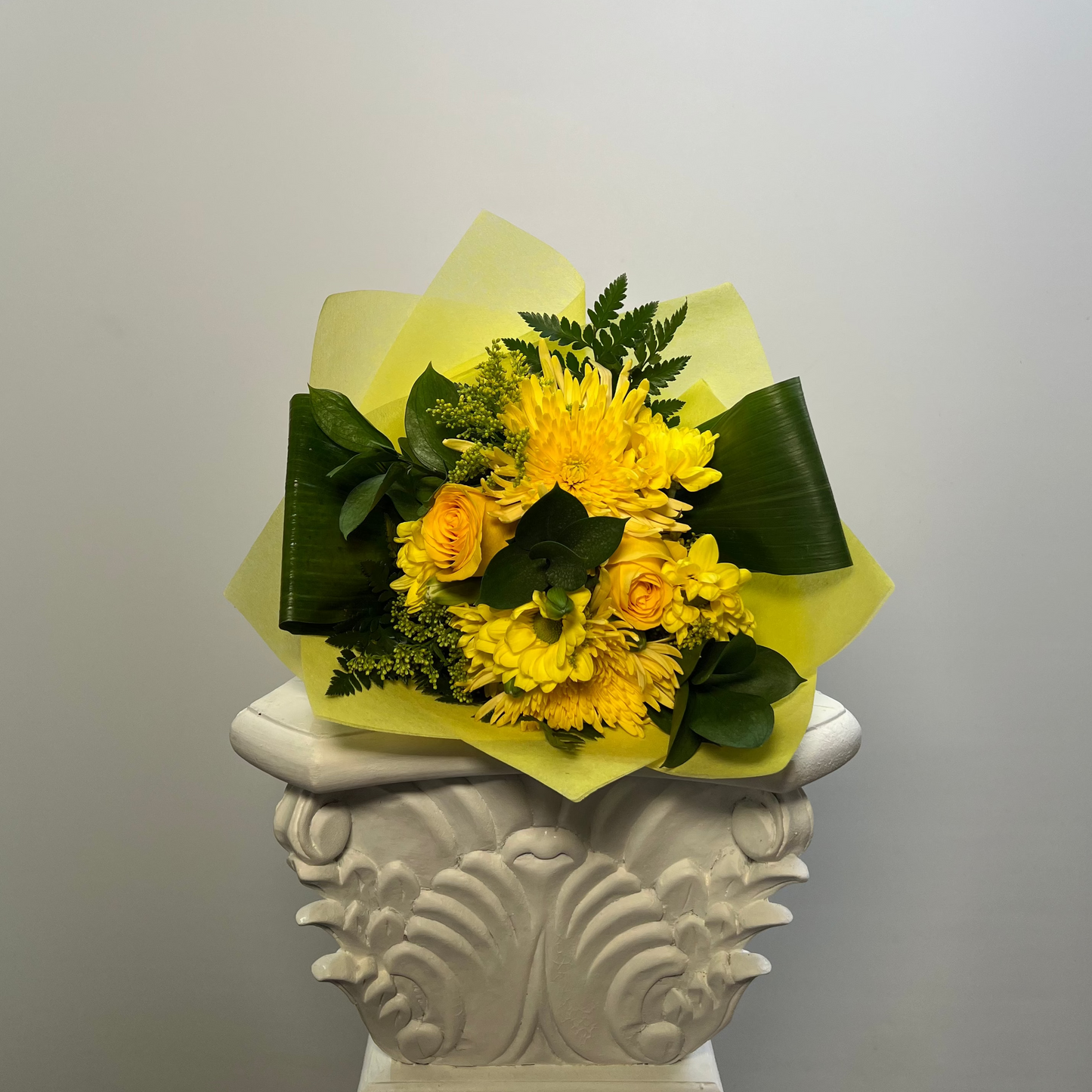 Small Yellow Flower Day bouquet with fresh yellow flowers and elegant wrapping in Houston
